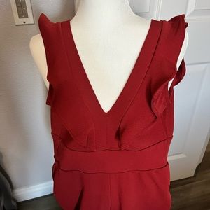 Burnt orange jumpsuit zipper in back ties in the back